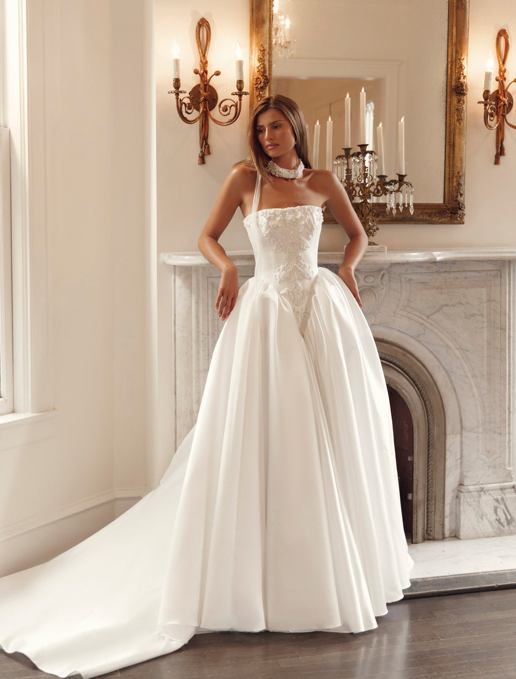 Julie Vino Genevive 3202 strapless ball gown wedding dress with a straight neckline, pointed lace corset bodice and full skirt.