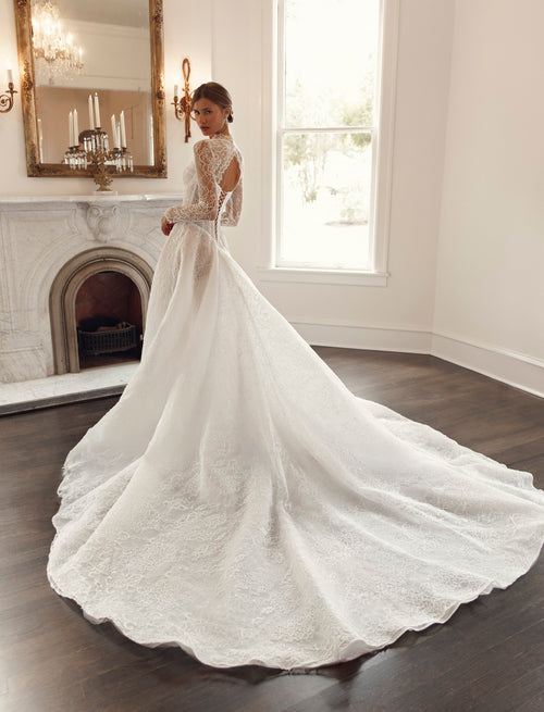 Back view of Julie Vino Collette 3207 wedding dress showing a lace keyhole back, lace-up corset and expansive lace-covered train.