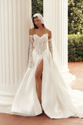 Julie Vino Alesssia 3208 wedding dress with a sheer lace corset, sweetheart neckline and high slit, styled with long lace sleeves and a veil.