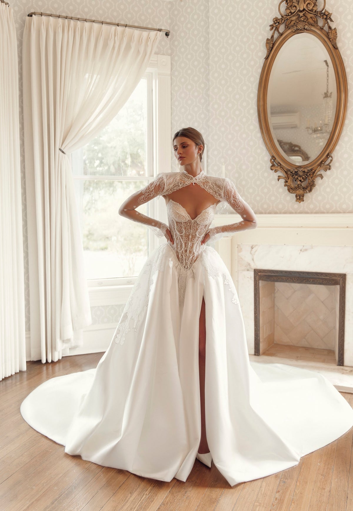 Front view of Julie Vino Noelle 3209 fitted lace wedding dress with a sweetheart neckline, styled with a high-neck lace capelet.