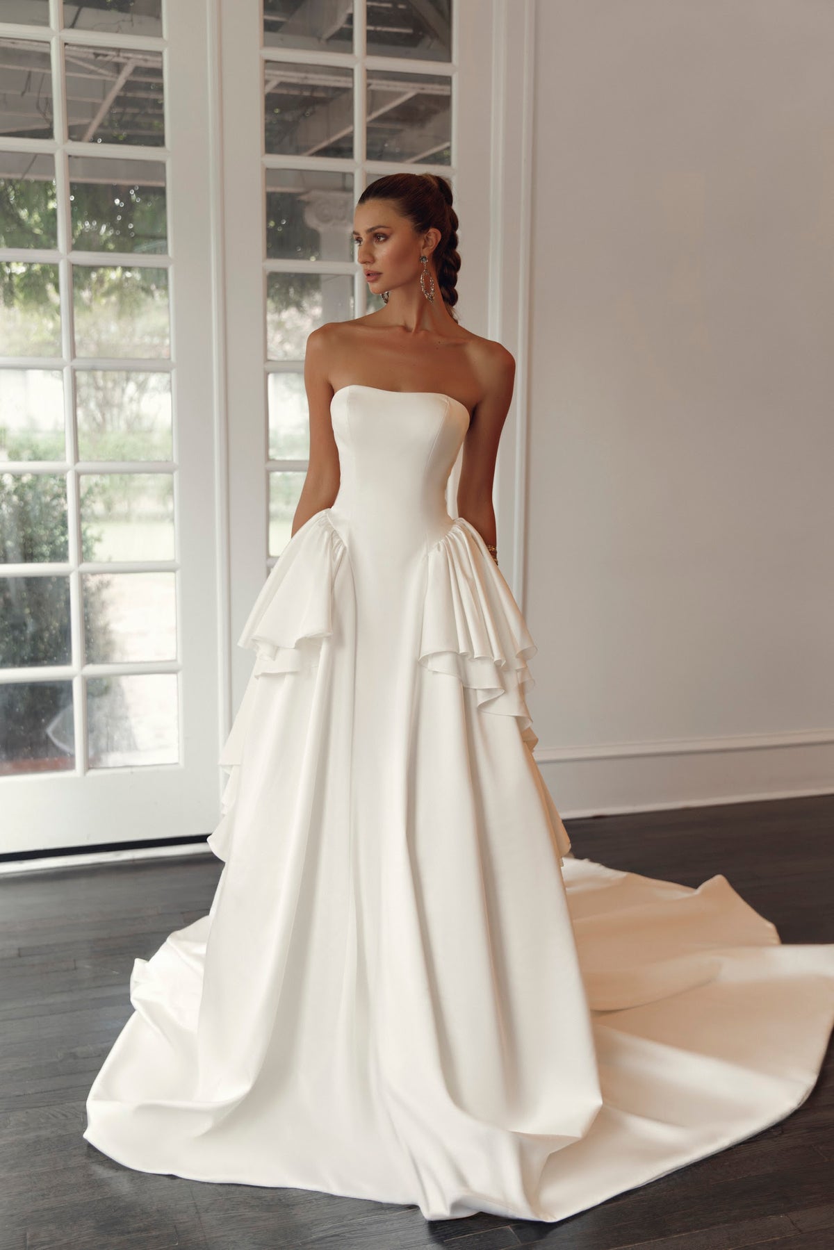 Back view of Valentina PR27-21 by Pure by Julie Vino, showing the lace-up corset bodice, layered ruffles and long sweeping train.