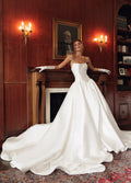 Front view of Rosalie PR27-22 by Pure by Julie Vino, showing the folded strapless neckline, pointed basque waist and full skirt, styled with gloves.