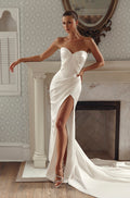 Front view of Noemi PR27-29 by Pure by Julie Vino, showing the strapless sweetheart bodice, diagonal folds, draped hips and high leg slit.