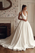 Front view of Vivia PR27-30 by Pure by Julie Vino, showing the plunging halter neckline, structured bodice and full gathered ball gown skirt.