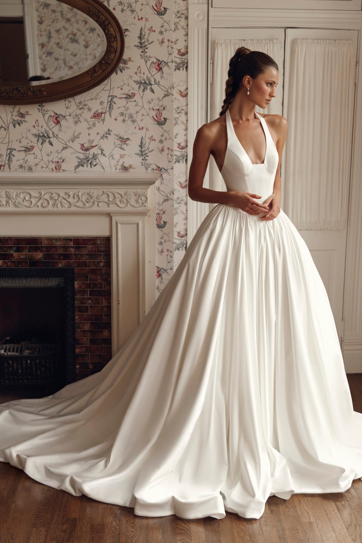 Front view of Vivia PR27-30 by Pure by Julie Vino, showing the plunging halter neckline, structured bodice and full gathered ball gown skirt.